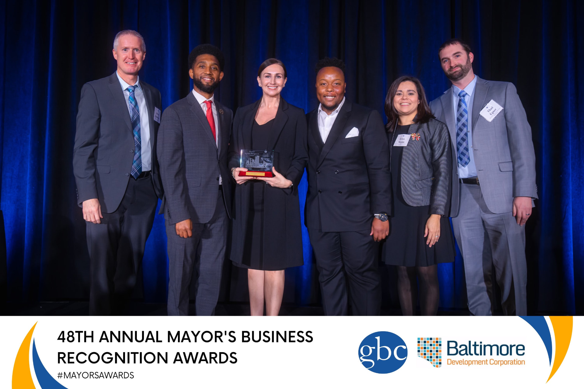 Paul Farrell and the Securityplus team accepting the Mayor's Business Recognition Award with Mayor Brandon Scott